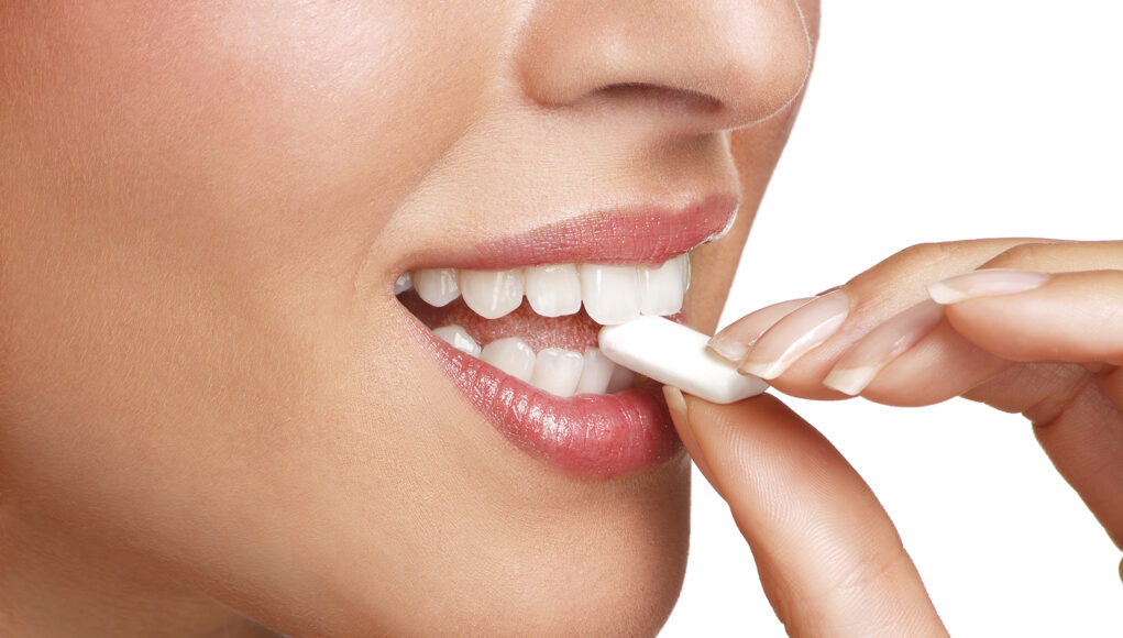 close up on beautiful girl while enjoying a candy