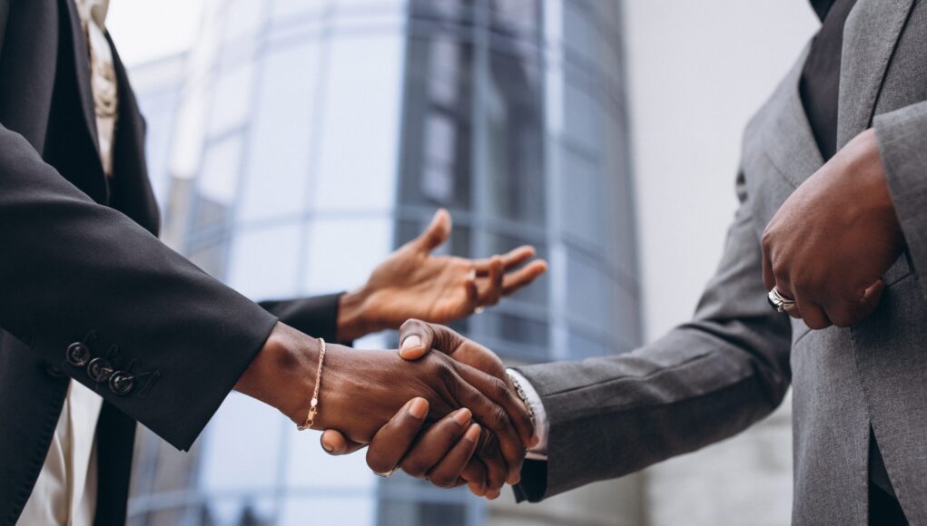 african-business-male-people-shaking-hands-scaled